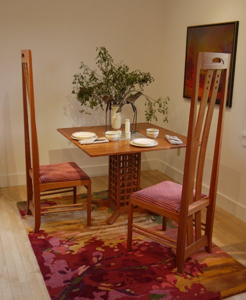 Tableau by Maine Street Design Co.|Portland. Furniture by Kevin Rodel, Brunswick. Cherry, stone, and fabric. Painting by Holly Ready, courtesy of Holly Ready Gallery, Portland.